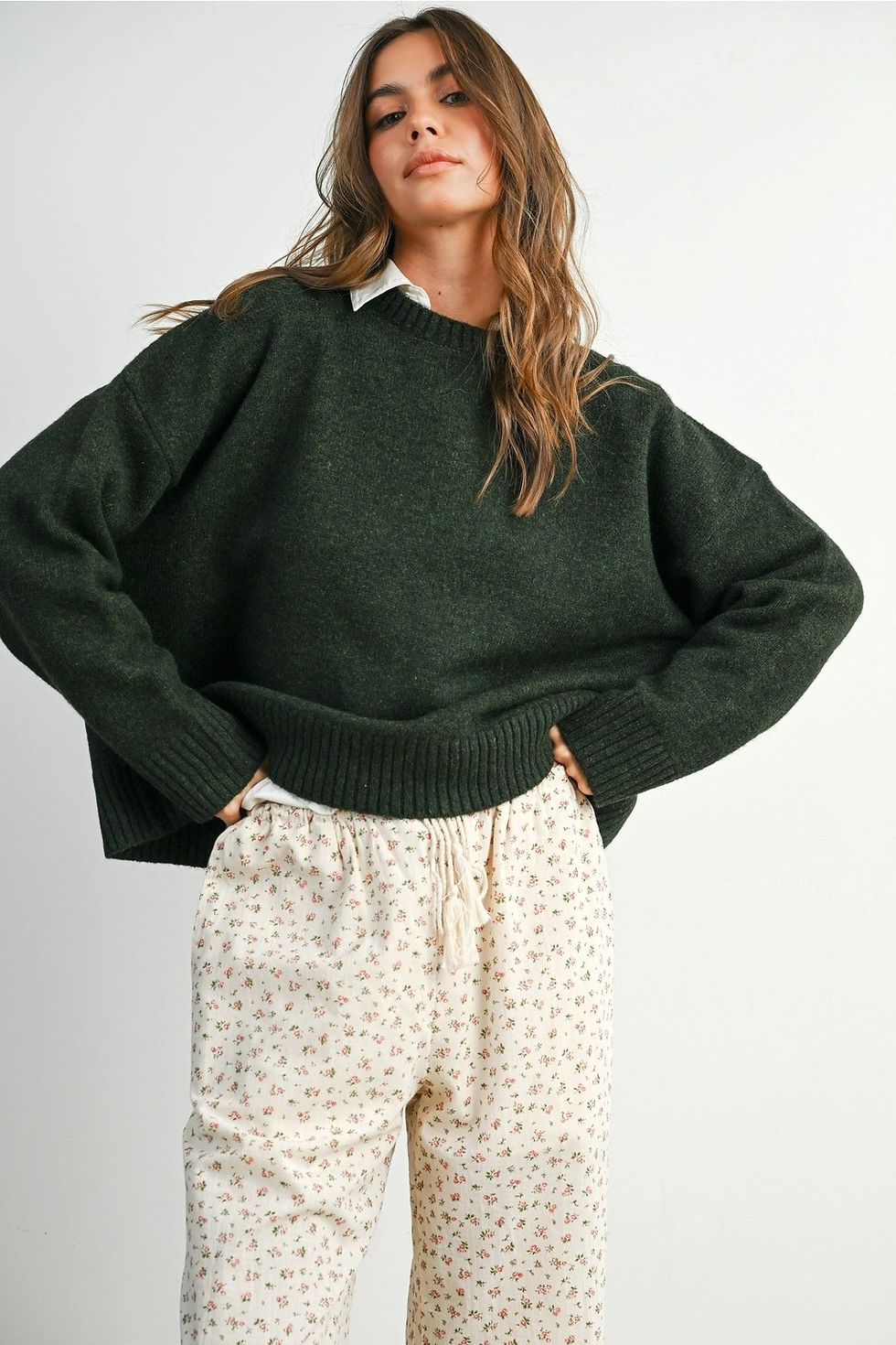 Thumbnail: Dark green knit sweater featuring an open back design with multiple tie closures