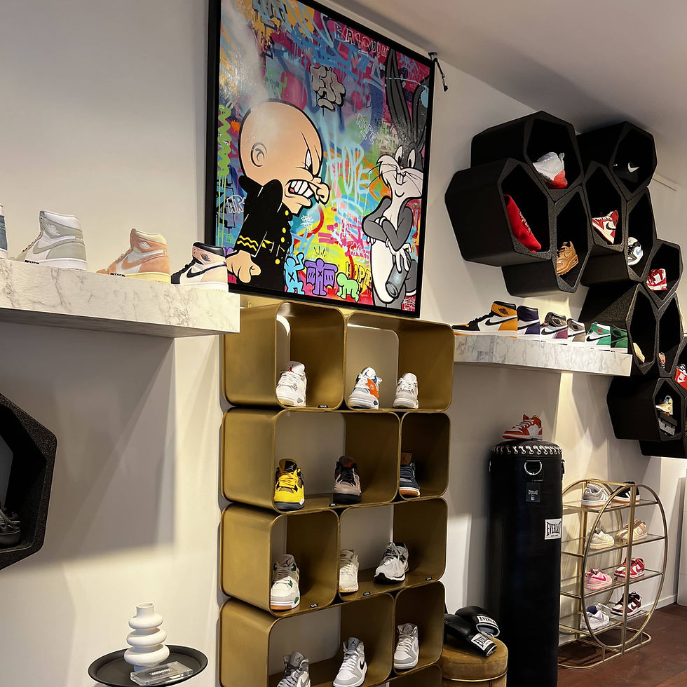 streetwear shop wall with artwork and shoes