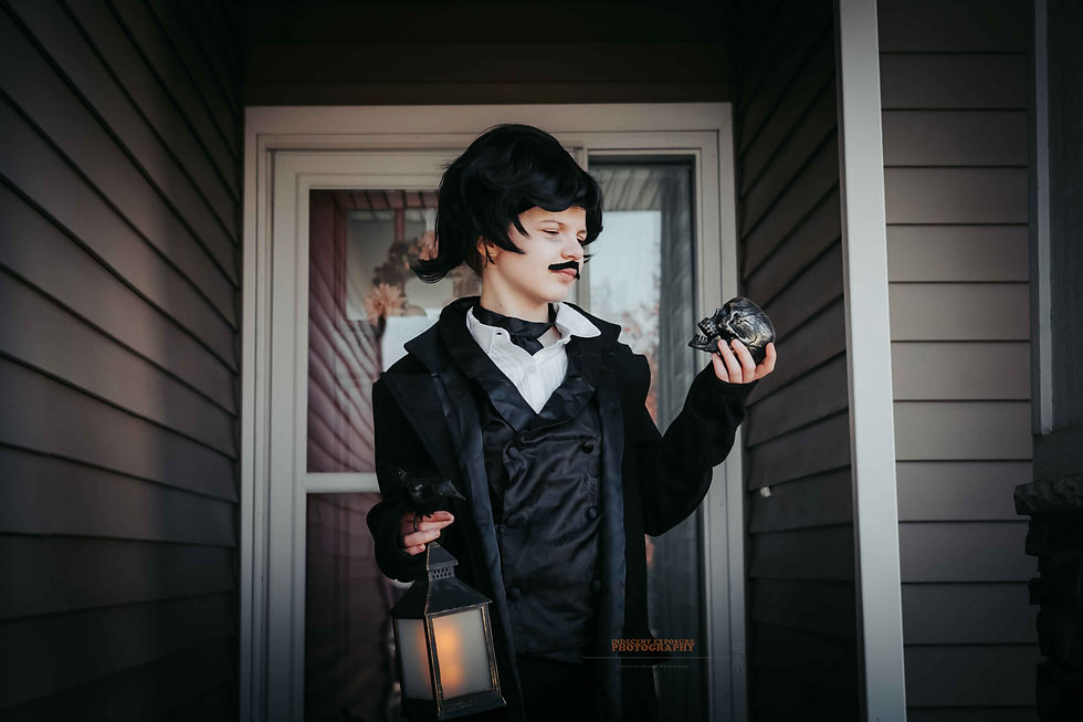 Girl in black Victorian attire holds a skull and lantern, standing on a porch. Dark, mysterious mood with muted siding background.