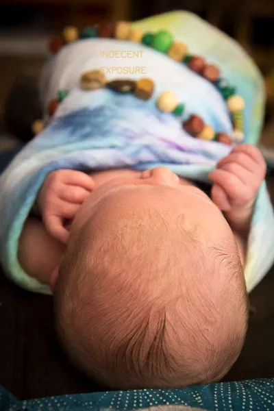 A newborn baby viewed from the top of the head.