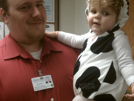 A toddler in a cow Halloween costume