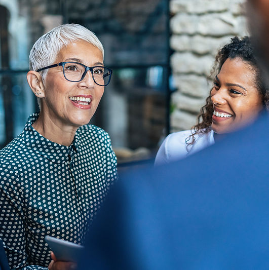 Professionals collaborating during a workforce strategy meeting.