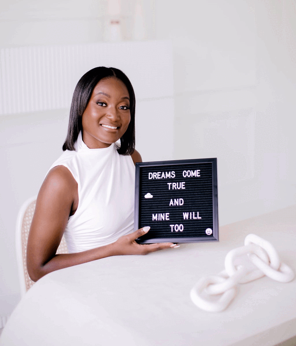 A two-picture GIF showing Danielle Ndende with a DCTMWT sign.
