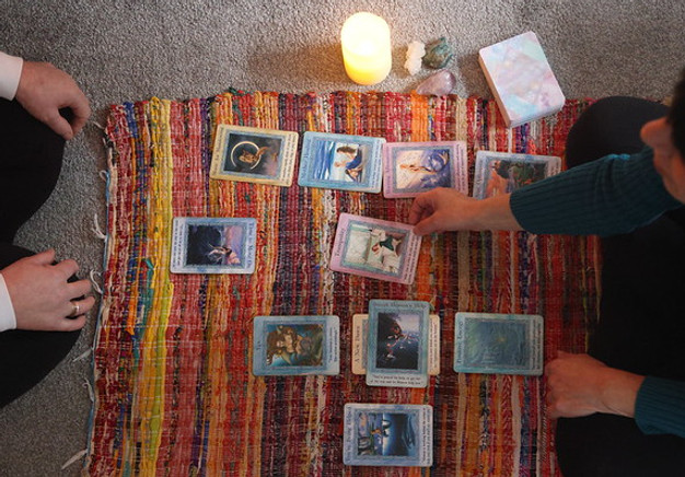 Card and crystal reading with client