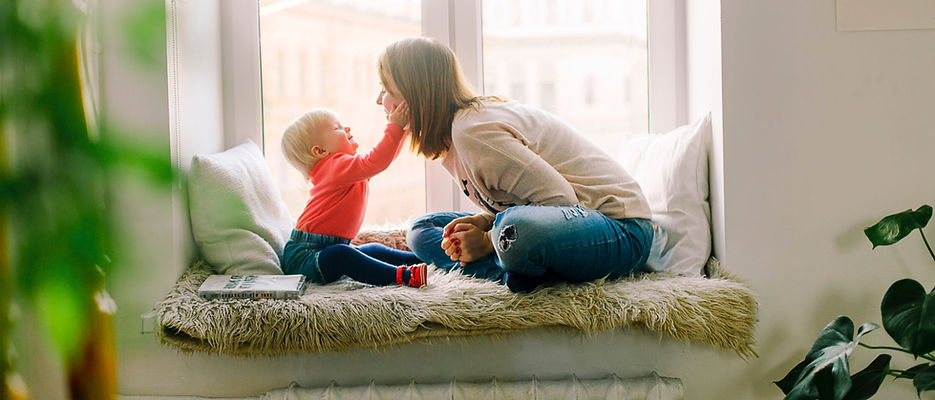 child touching moms face