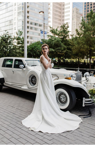 white 4-door excalibur and bride in Dallas Texas