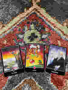 Taro cards depicting the Fool, Stress, and the Sage