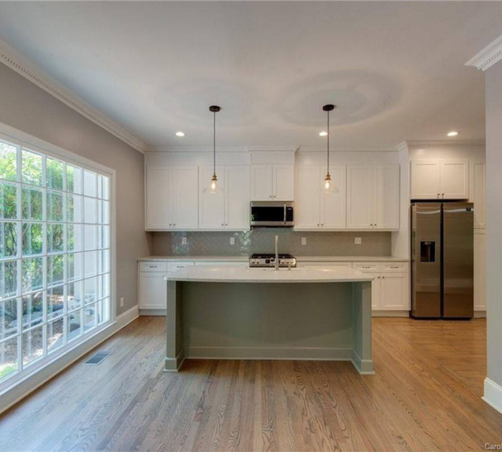 High angle view of a bathroom renovation showing new tile flooring and modern fixtures