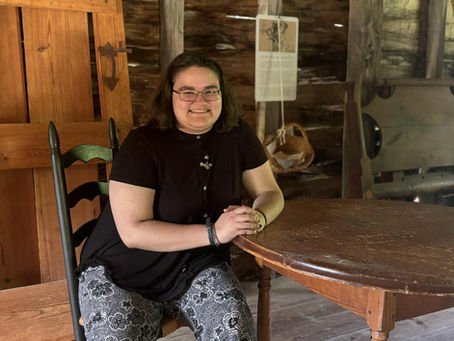 Our summer history intern, Elizabeth Fitzpatrick, poses for a photo inside the Carpenter Shop.
