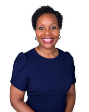 Professional headshot of a smiling woman for speaking events