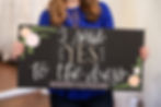 Bride holding I said YES to the dress sign at Marry Go Round Bridal