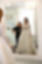 Bride trying on wedding gown during appointment with stylist at Marry Go Round Bridal