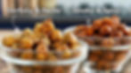 Two glass bowls with chickpeas; one labeled Garlicky & Herby, the other Smoky & Spicy. Blurred kitchen background.