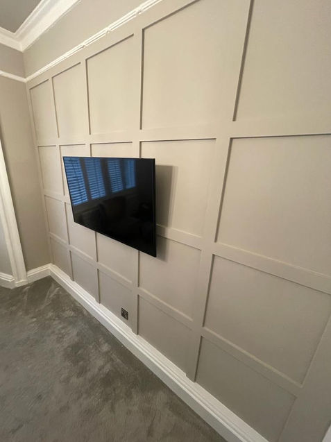 A modern and sophisticated wall paneling was installed along the length of one wall, serving as an elegant backdrop behind the television. Meticulous attention was given to the finishings to guarantee a premium quality result.

Edinburgh commercial joinery and shop-fitting. Bespoke joinery. Custom woodwork. Carpentry services. Joinery company. Edinburgh joiners. Wooden furniture. Handcrafted woodwork. Timber frames. Woodworking experts. Cabinet makers. Wood renovation. Wood finishing. Staircase design. Door installation. Wood restoration. Wood carving. Shop fitting. Kitchen renovation. Bathroom renovation. Commercial joinery. Joinery company in Edinburgh. Renovation specialists in Edinburgh.

Copyright Jigsaw Joiners Edinburgh Ltd.