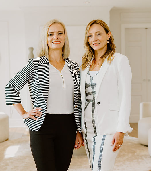 portrait of Violet and Jena in business outfits