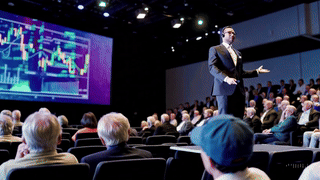 Financial advisor sharing ideas with an audience