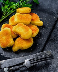 nuggets-pollo-al-horno-crujientes_89816-