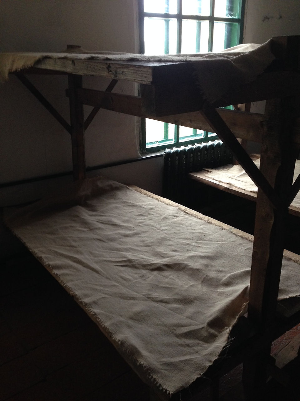 Wooden plank beds at the camp