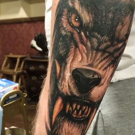 wolf black and grey realism tattoo london detailed fur shading aggressive animal portrait tattoo