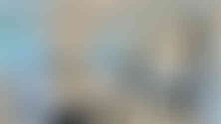 modern mirror feature wall in luxury dining room with chandelier and round table