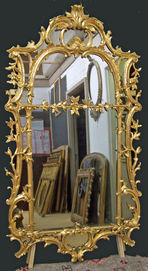 restored grey smoked mirror with ornate gold gilt frame showing detailed craftsmanship and antique finish