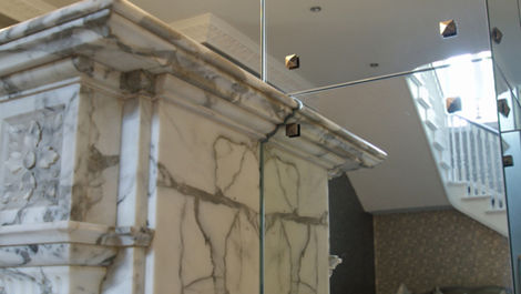 multi pane art deco mirror wall with marble detailing in cheshire entrance hall