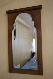 hand-cut bevelled mirror restored and refitted into wooden frame showing traditional craftsmanship and polished edge finish