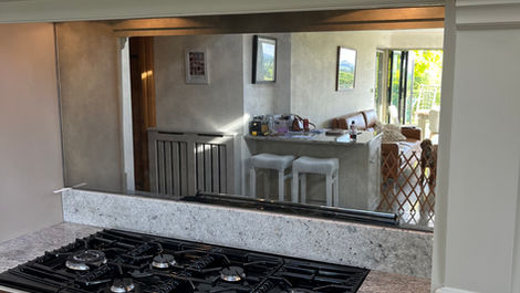 Distressed mirror kitchen splashback by Mirror Works, handcrafted for light, depth, and timeless luxury.