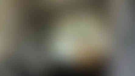 Hand-silvered antique mirror splashback by Mirror Works, custom-made and fitted behind range cooker for a refined kitchen finish