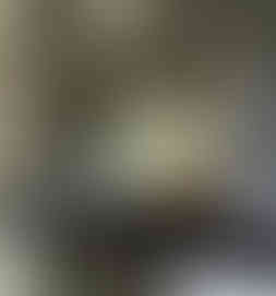 Hand-silvered antique mirror splashback by Mirror Works, custom-made and fitted behind range cooker for a refined kitchen finish