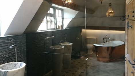 Bathroom cabinet clad with antique mirrors for a unique, luxurious design feature