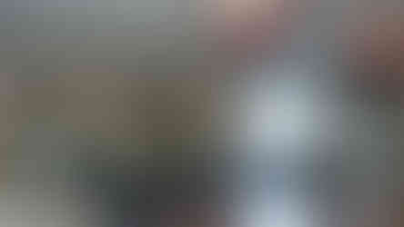 Handmade antique mirror splashback by Mirror Works installed behind stove in modern kitchen, reflecting light and craftsmanship.