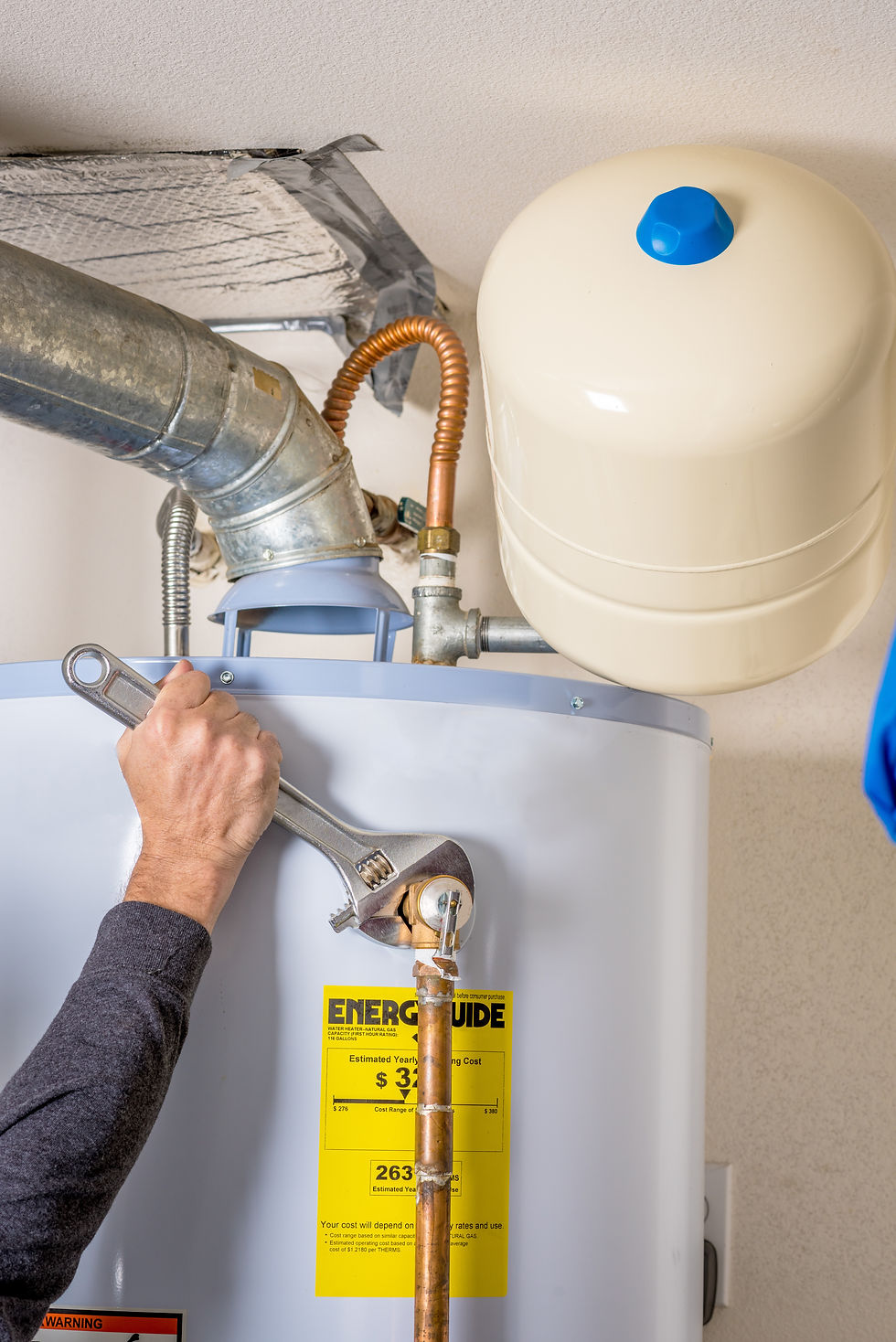Plumber installing hot water recirculating system on tank water heater in Southwest Florida