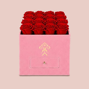 Sixteen red preserved roses in a pink suede gift box with drawer