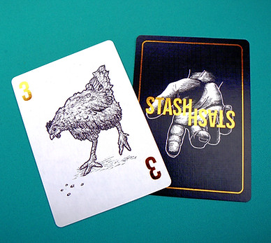 Players' cards arranged on a table during a game of STASH, a strategy card game about collecting and protecting treasure.