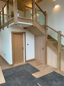 wooden staircase to higher level inside house