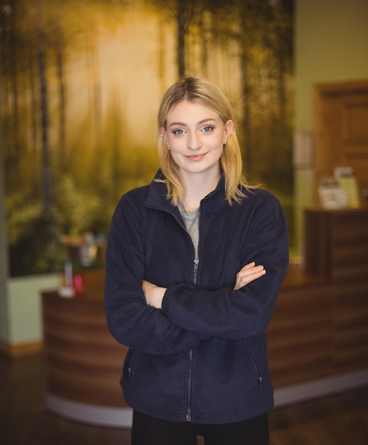 Replace the current home-focused portrait
photo with a professional image of a uniformed cleaner in a
commercial or office environment — warm, approachable,
professional feel.