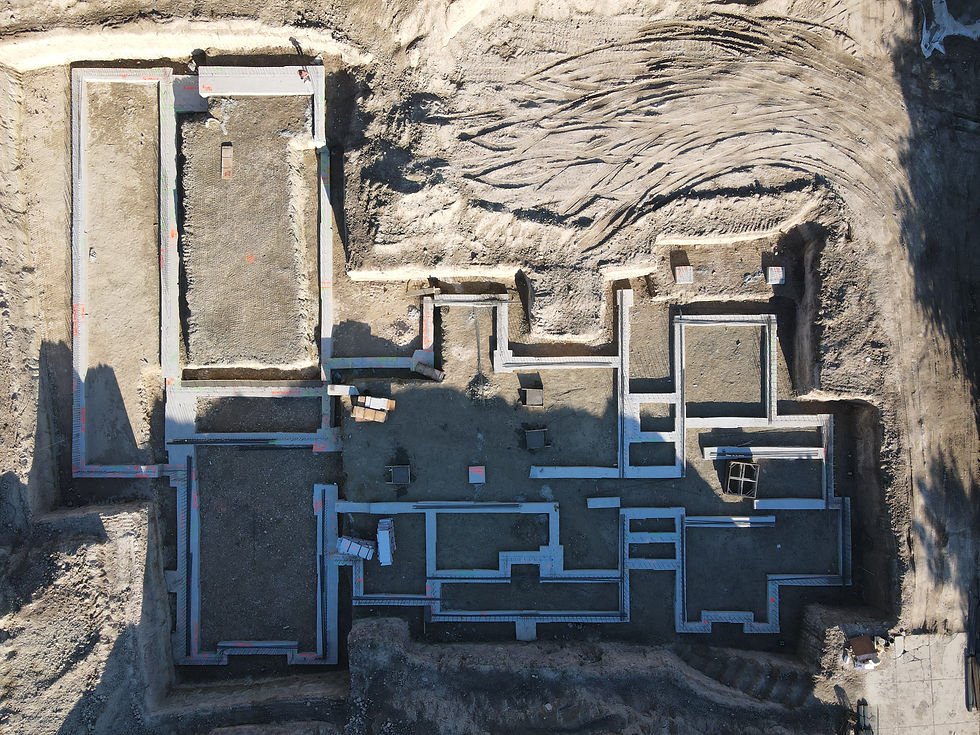 Bird's eye view showing the excavation and footings for a new house.