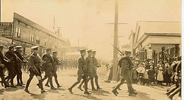 MILITARY PARADE WHEELS NORTH FROM MAIN STREET ONTO BRIDGE AVENUE