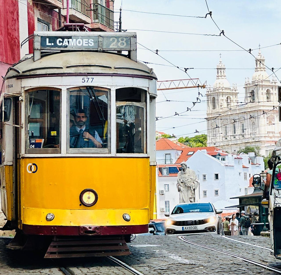 LISBON - trolley No 28 with Catherdral de Se in background Alfama