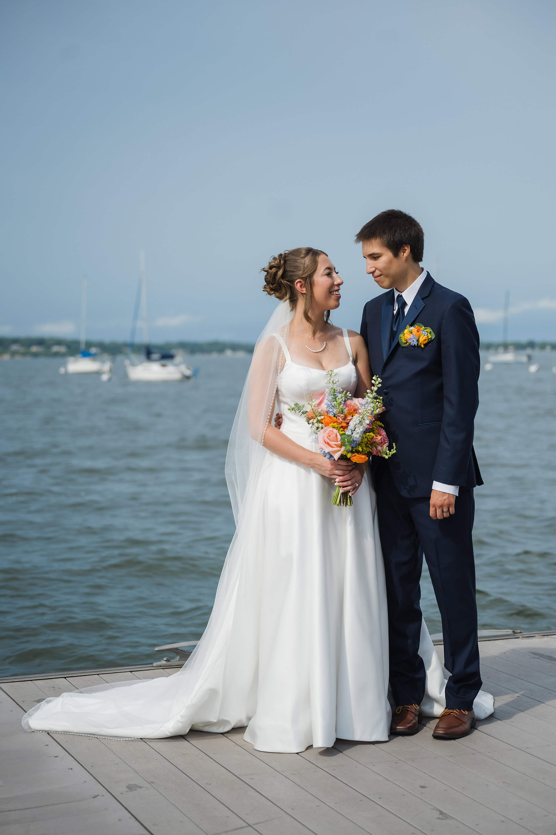 bride and groom by lake mendota