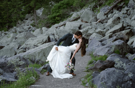 bride and groom on tumbled rocks trail devils lake