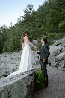 bride and groom on tumbled rocks trail devils lake