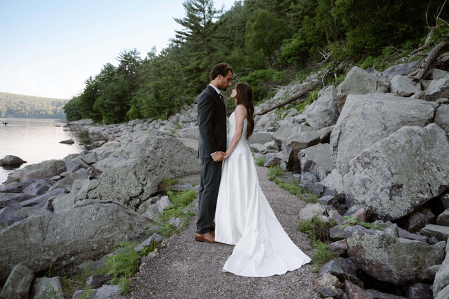 bride and groom on tumbled rocks trail devils lake