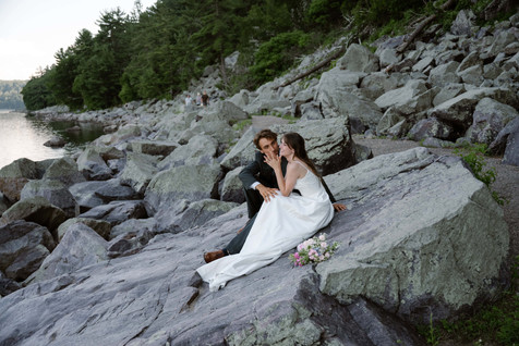 bride and groom on tumbled rocks trail devils lake