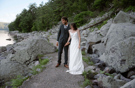 bride and groom on tumbled rocks trail devils lake