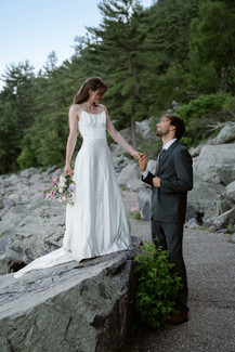 bride and groom on tumbled rocks trail devils lake