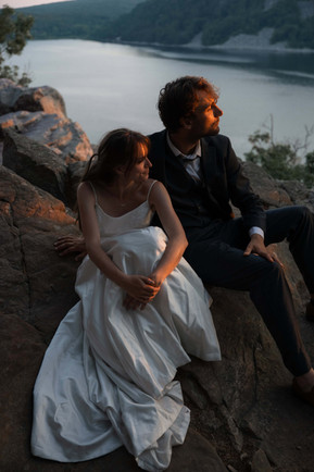 bride and groom at devils lake east bluff trail at sunset