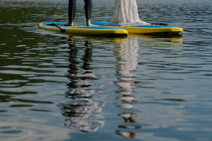 devil's lake paddle boarding bride and groom