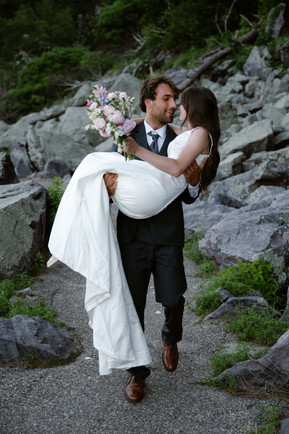 bride and groom on tumbled rocks trail devils lake